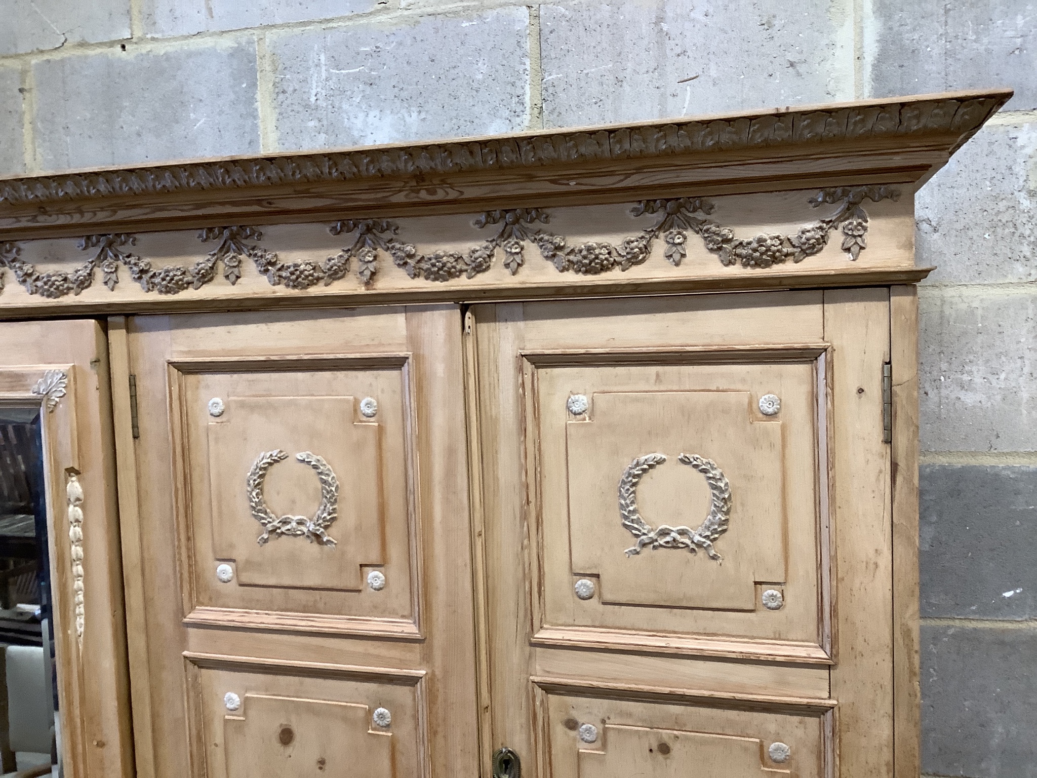 An Edwardian pine compactum wardrobe retailed by Maple & Co., length 113cm, depth 60cm, height 196cm